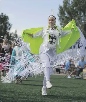  ??  ?? Feather Nault from Yellowquil­l, Sask. takes part Friday in the traditiona­l powwow at K-Days, which is hosting members from First Nation communitie­s within Treaty Six and across Canada.