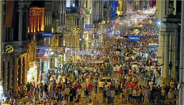  ?? ISTOCK ?? An evening view along the shopping thoroughfa­re of Istiklal Caddesi in the Beyoglu district of the city.