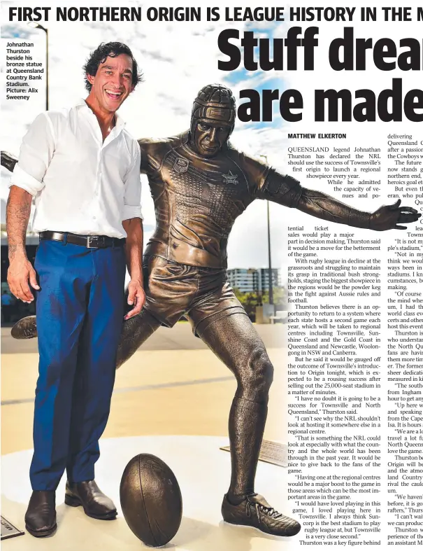  ??  ?? Johnathan Thurston beside his bronze statue at Queensland Country Bank Stadium. Picture: Alix Sweeney