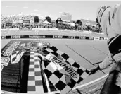  ?? JEFF ZELEVANSKY/GETTY IMAGES ?? Martin Truex Jr. crosses the finish line Sunday to collect his season-leading fourth victory of the season.