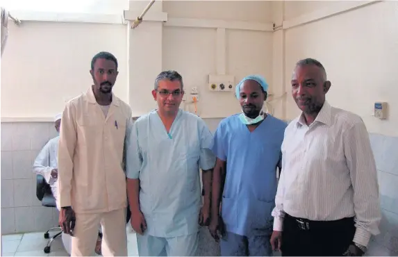  ??  ?? > Dr Zaheer Yousef (second from left) with the expert cardiology team in Sudan