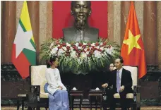  ?? Reuters ?? Aung San Suu Kyi, left, meets Vietnam’s President Tran Dai Quang during the World Economic Forum in Hanoi