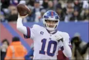  ?? BILL KOSTROUN - THE ASSOCIATED PRESS ?? FILE - In this Sunday, Dec. 10, 2017 file photo, New York Giants quarterbac­k Eli Manning (10) throws a pass during the first quarter of an NFL football game against the Dallas Cowboys in East Rutherford, N.J. In his turbulent 14th NFL season, Eli...