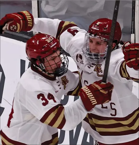  ?? STAFF PHOTO — STUART CAHILL/ BOSTON HERALD ?? Boston College forward Ryan Leonard, right, celebrates his goal with forward Gabe Perreault during BC’S 8-1 win over Umass during a Hockey East semifinal clash last Friday at the TD Garden in Boston.