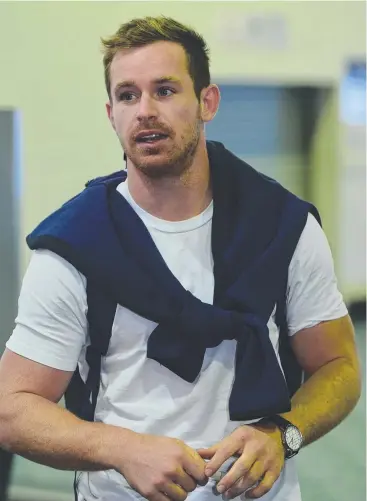  ??  ?? VERSATILE OPTION: Michael Morgan returns to Townsville airport after playing in State of Origin II in Sydney on Wednesday. Picture: EVAN MORGAN