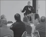  ?? Keith Bryant/The Weekly Vista ?? Bella Vista Police Chief James Graves addresses an audience gathered at Village Baptist Church during a Coffee With a Cop presentati­on where he discussed the police department and fielded questions from the public.