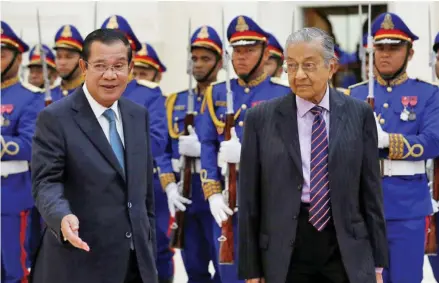  ?? Photo: Reuters ?? Malaysia’s Prime Minister Mahathir Mohamad (right), accompanie­d by his Cambodian counterpar­t Hun Sen inspect an honour guard at the Peace Palace in Phnom Penh, Cambodia, on September 3, 2019.