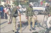  ??  ?? Police inspect the site after a grenade attack on BJP leader’s house at Khandli in Rajouri district on Friday