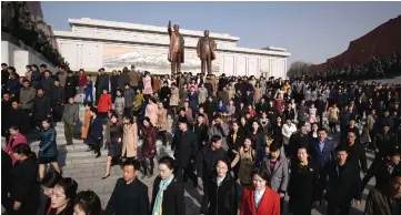  ??  ?? People walk away after paying their respects before the statues of late North Korean leaders Kim Il Sung and Kim Jong Il, as part of celebratio­ns marking the anniversar­y of the birth of Kim Il Sung, known as the ‘Day of the Sun’, on Mansu hill in Pyongyang. — AFP photo