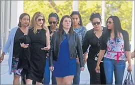  ?? Red Huber Orlando Sentinel ?? PULSE OWNER Barbara Poma, second from left, leaves court on Friday with victims’ family members after the acquittal of the gunman’s widow, Noor Salman.