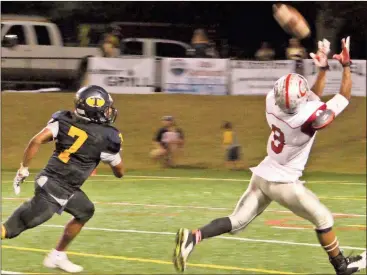  ??  ?? Cedartown’s Quan Neal keeps pace with a throw that resulted in a Bulldog touchdown in the first half at Troup County on Thursday, Oct. 20.