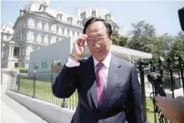  ?? — Reuters file photo ?? Foxconn Chairman Terry Gou talks to reporters as he exits the White House following meetings in Washington.