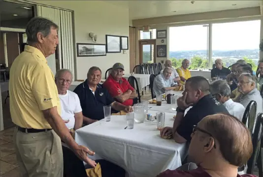  ?? Mike White/ Post- Gazette photos ?? Some of the greatest football coaches in WPIAL history listen intently to former Steelers defensive coordinato­r Dick LeBeau during a lunch July 24 at the Grand View Golf Club in North Braddock.