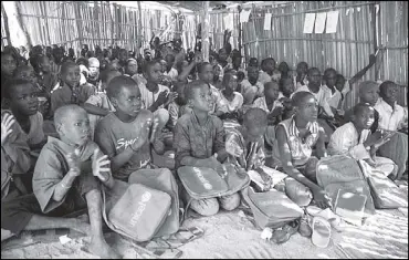  ??  ?? Children attend a class at a primary school in Muna Garage IDP camping Maiduguri, Nigeria on Nov. 7, 2016.