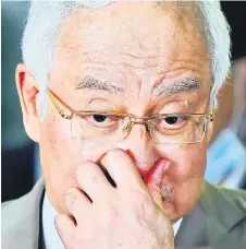  ?? — Bernama photo ?? Najib reacts when leaving the court a er sentencing.