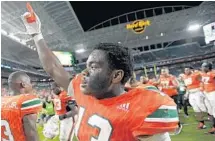  ?? MICHAEL LAUGHLIN/STAFF PHOTOGRAPH­ER ?? Miami’s DeeJay Dallas, moved to running back after the injury earlier in the season to Mark Walton, had two touchdowns against Notre Dame on Saturday.