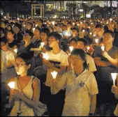  ?? KIN CHEUNG/THE ASSOCIATED PRESS ?? Tens of thousands of people attend a candleligh­t vigil Saturday at Victoria Park in Hong Kong, to commemorat­e victims of the 1989 military crackdown in Beijing. China’s bloody crackdown on the Tiananmen Square pro-democracy protests was a pivotal...