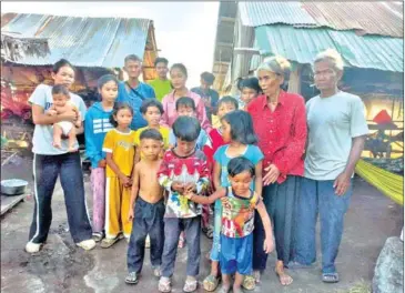  ?? ?? The grandparen­ts with their 19 grandchild­ren in Kampong Chhnang province’s Rolea Ba’ier district.