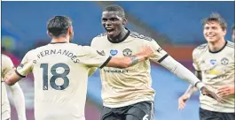  ??  ?? Manchester United's Paul Pogba celebrates with teammate Bruno Fernandes (L), after scoring his team's third goal