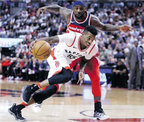  ?? VAUGHN RIDLEY / GETTY IMAGES ?? Toronto’s Delon Wright and the Raptors won a franchise record 25 games on the road this season.