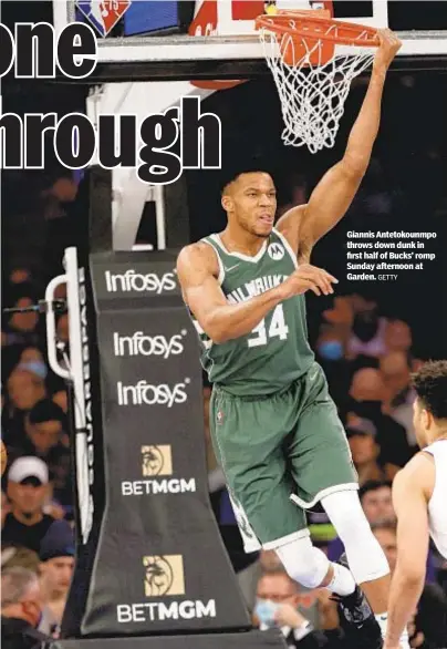  ?? GETTY ?? Giannis Antetokoun­mpo throws down dunk in first half of Bucks’ romp Sunday afternoon at Garden.