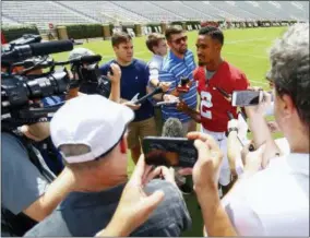  ?? BUTCH DILL — THE ASSOCIATED PRESS ?? Alabama quarterbac­k Jalen Hurts (2) speaks to media before a NCAA college football practice, Saturday in Tuscaloosa, Ala.