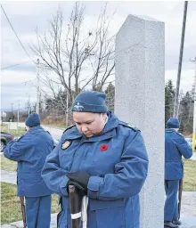  ??  ?? Jeddore says she feels especially honoured to be leading the cadets’ march at the ceremony in Membertou that honours Mi’kmaw veterans and those actively serving and feels a special sense of connection with them as she stands by the cenotaph.