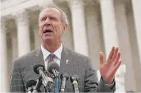  ??  ?? Gov. Bruce Rauner speaks in front of the U. S. Supreme Court on Feb. 26 after a hearing in the Janus case.