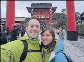  ?? CONTRIBUTE­D ?? Nate and Jessica Baumgart pose for a selfie in front of the Fushimi Inari-taisha shrine in Kyoto, Japan. The Baumgarts recently returned home after a yearlong trip around the world.