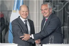  ?? AFP ?? Argentine President Alberto Fernandez and German Chancellor Olaf Scholz, left, shake hands during a joint presser on Saturday.