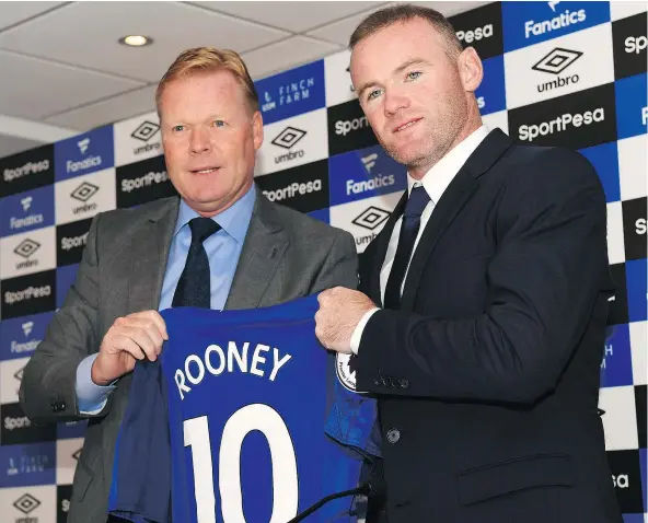  ?? — GETTY IMAGES FILES ?? English striker Wayne Rooney, right, is back with Everton after 12 seasons at Old Trafford.