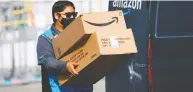  ?? PATRICK T. FALLON / AFP VIA GETTY IMAGES / FILES ?? Amazon makes it easy for people to buy as few as one item at a time without having to worry about the added
cost of shipping fees, Jesse Kline writes.