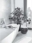  ?? Design Recipes/TNS ?? Gray tile in a bathroom creates a soothing look.