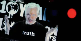  ?? AXEL SCHMIDT/REUTERS ?? WikiLeaks editor-in-chief Julian Assange speaks via video link during a press conference last year. WikiLeaks’ influence on the US presidenti­al election has been brushed away by President-elect Donald Trump.