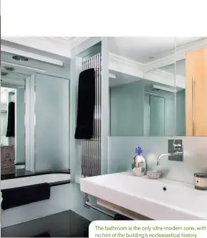  ??  ?? The bathroom is the only ultra-modern zone, with no hint of the building’s ecclesiast­ical history