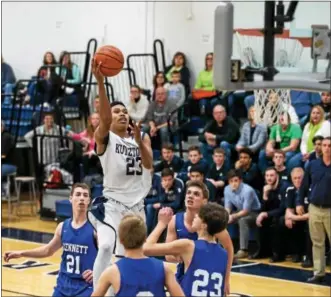  ?? DENNIS KRUMANOCKE­R - FOR DIGITAL FIRST MEDIA ?? Kutztown’s Lorencz Jean-Baptiste skies over the Kennett defense for a basket during his 39-point night in a non-league win on Jan. 6.