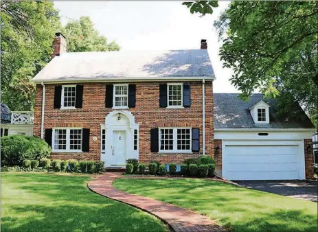  ?? CONTRIBUTE­D PHOTOS BY KATHY TYLER ?? The brick 2-story has about 3,000 sq. ft. of living space plus a full basement with bonus room and half bath. The house has an attached, 2-car garage and a concrete patio.