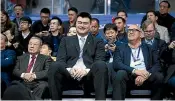  ?? FIBA ?? Burton Shipley, right, sits with Chinese basketball legend Yao Ming, centre, at the Tall Blacks’ game against China in Dongguan on February 23.