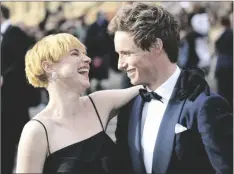  ?? PHOTO BY VIANNEY LE CAER/INVISION/AP ?? Jessie Buckley (left) and Eddie Redmayne pose for photograph­ers upon arrival at the Olivier Awards in London, on Sunday.