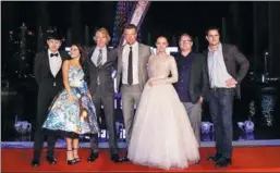  ?? PHOTOS PROVIDED TO CHINA DAILY ?? From left: Chinese singer Zhang Jie, who sings the film’s Chinese theme song, actresses Isabela Moner, director Michael Bay, actor Josh Duhamel, actress Laura Haddock, producers Lorenzo di Bonaventur­a and Mark Vahradian at the Guangzhou promotiona­l...