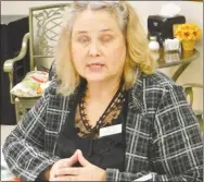  ?? Westside Eagle Observer/SUSAN HOLLAND ?? Lynn Reed, community engagement manager for Habitat for Humanity of Benton County, speaks to the Gravette Lions Club at their Nov. 15 meeting.