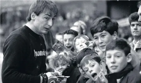  ??  ?? Tony Norman meets young fans back in 1988.