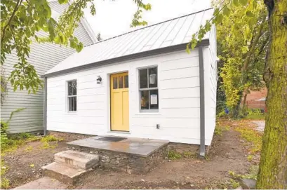  ?? AMY DAVIS/BALTIMORE SUN PHOTOS ?? This log cabin was moved to a historic Black community in Hagerstown circa 1830, but dendrochro­nology has determined logs used in its original constructi­on were felled in the winter of 1739. Preservati­on Maryland purchased and renovated the home.