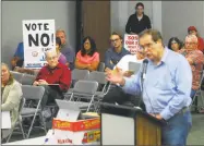  ?? Hearst Connecticu­t Media file photo ?? Resident John Babina speaks during a public hearing at the Planning and Zoning Commission meeting in the Shelton City Hall Auditorium on September 2016. Many residents came to the meeting to hold a protest because of the committees decision about...