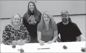  ?? Photo by Susan Holland ?? Stephanie Pinter, a senior at Gravette High School, signed Friday to play college volleyball at Grand View University in Des Moines, Iowa. She is pictured at the signing with her parents, Jodi and Stephen Pinter, of Bella Vista, and Katie Collins...