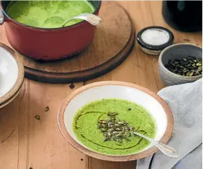  ?? NICOLA GALLOWAY ?? Lettuce soup with popped pumpkin seeds is a delicious spring recipe, which uses up extra lettuce leaves when your plants are threatenin­g to bolt.