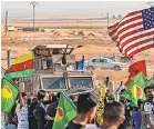  ?? DELIL SOULEIMAN/ AFP VIA GETTY IMAGES ?? Syrian Kurds protest the threat of a Turkish incursion in Syria on Sunday.