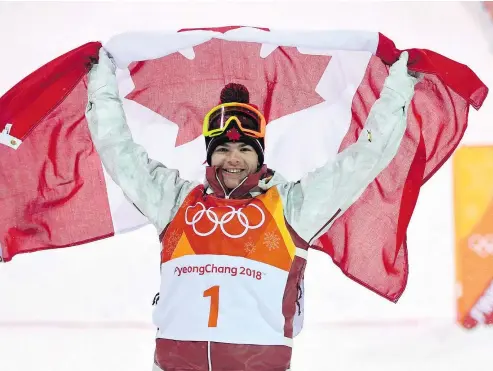  ?? — THE CANADIAN PRESS/FILES ?? Mikael Kingsbury celebrates after winning the men’s moguls at the 2018 Winter Olympic Games in South Korea. The freestyle ski star has won the 2018 Lou Marsh Trophy as Canada’s athlete of the year.