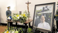  ?? —LYN RILLON ?? HIS ‘BOSSES’ IN MOURNING Members of an honor guard stand in vigil next to the urn containing the cremated remains of former President Benigno Aquino III at Heritage Memorial Park in Taguig City on Thursday night.