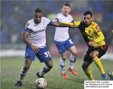  ??  ?? Neil Danns, left, in action for Tranmere in a FA Cup tie with Watford last season